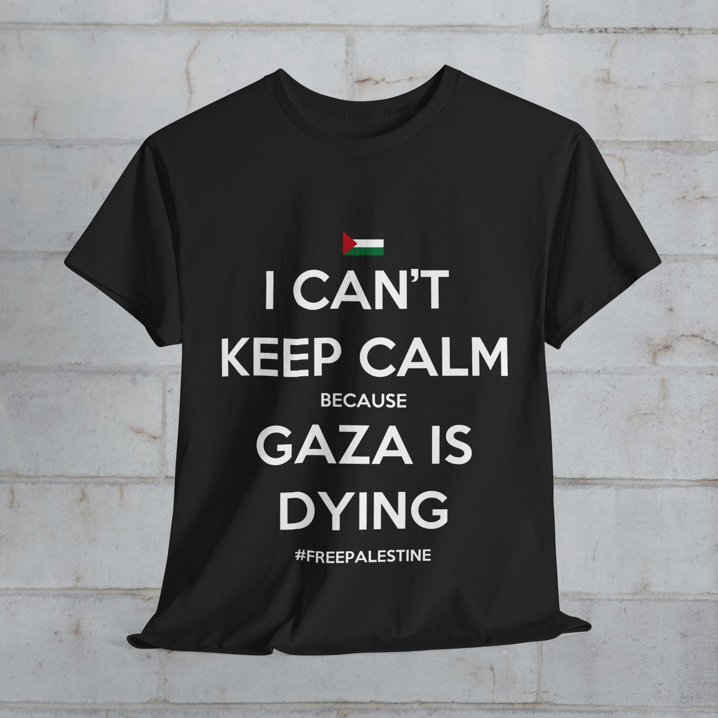 A black unisex cotton tee with white text 'I CANT KEEP CALM BECAUSE GAZA IS DYING' and a small flag symbol on the front.