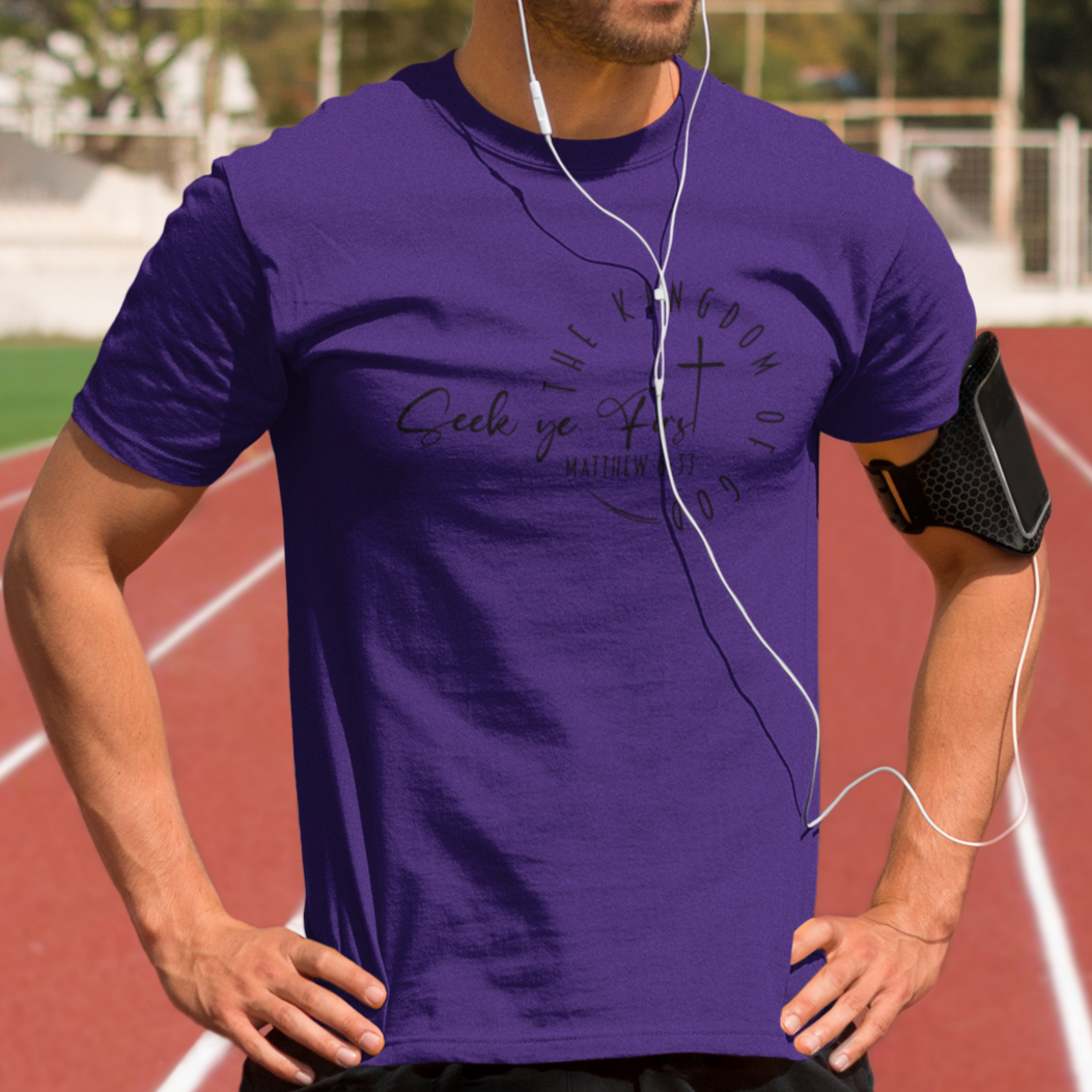 Man wearing a purple t-shirt on a running track