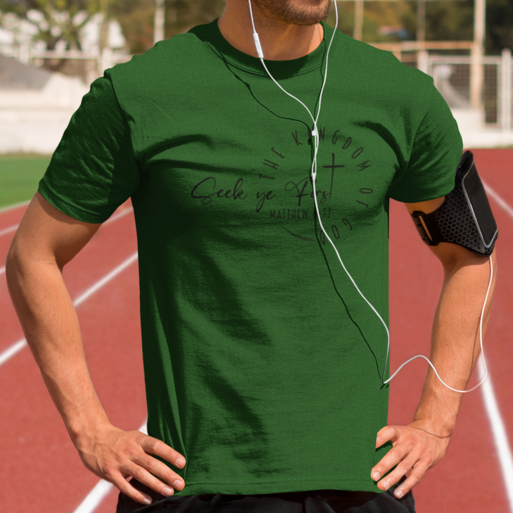 Man wearing a green t-shirt on a running track