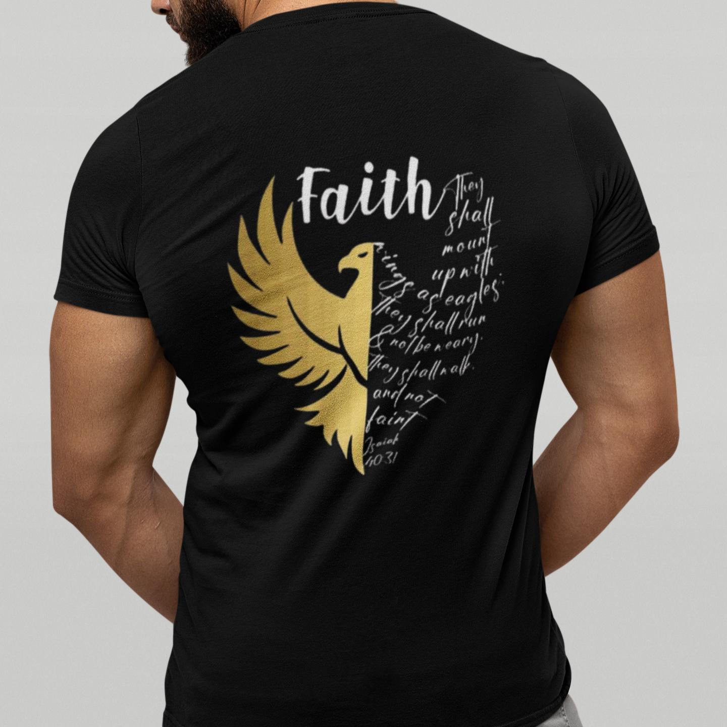 Black t-shirt with gold eagle design and text on the back, worn by a person.