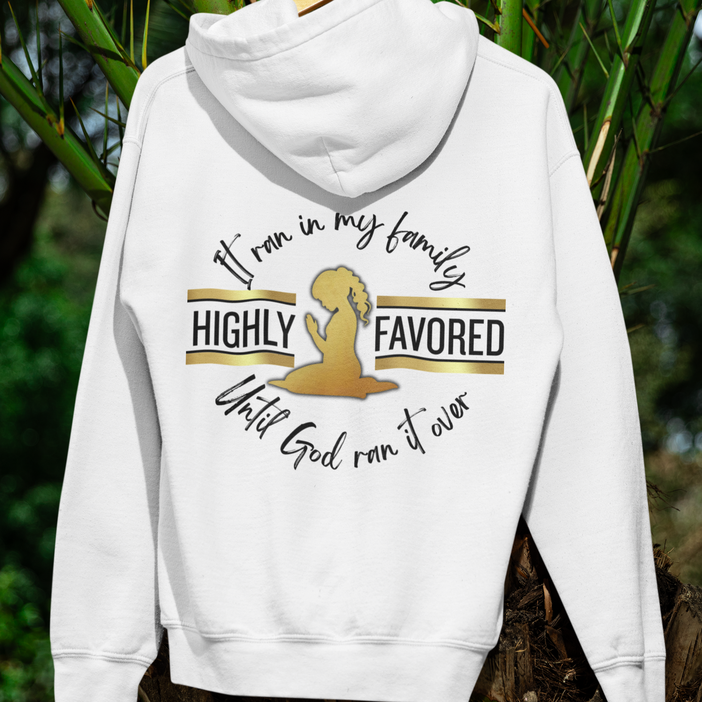 White hoodie with text and graphic on the back, displayed against a natural background.