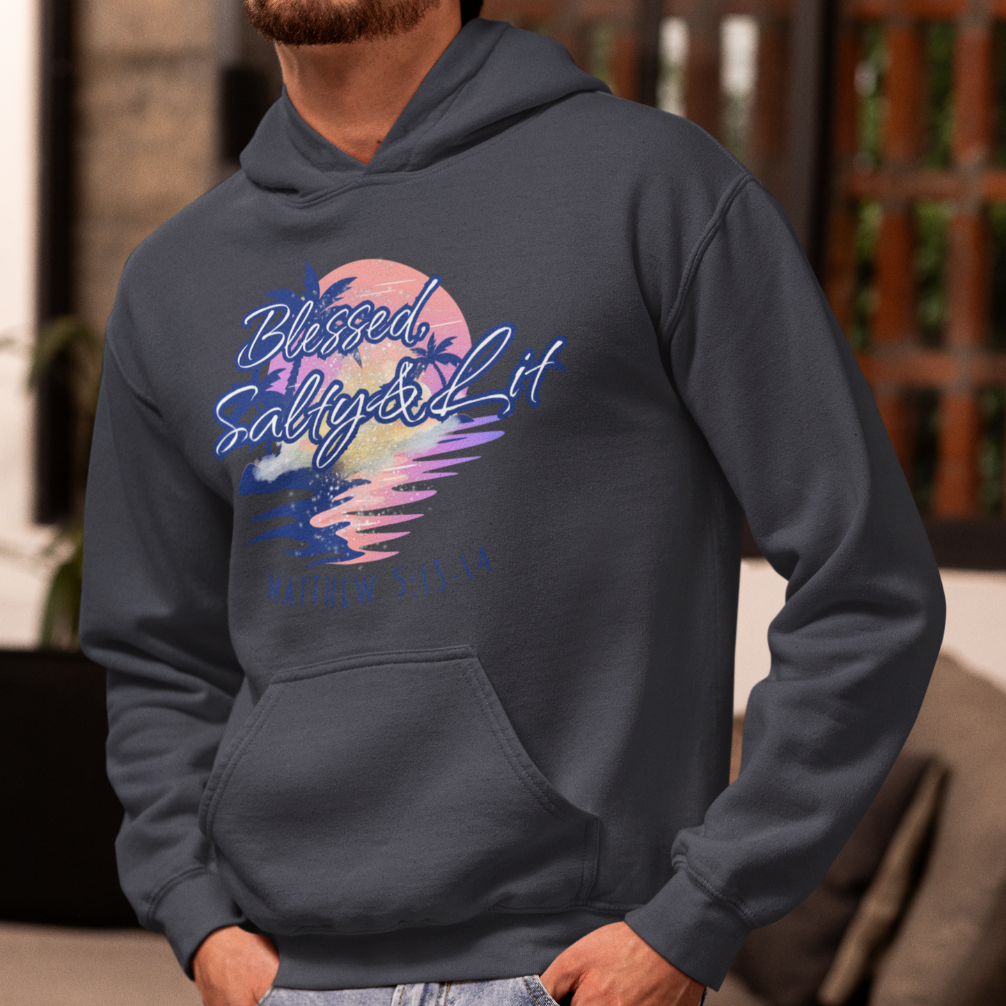 Person wearing a hoodie with a colorful graphic design in a casual setting