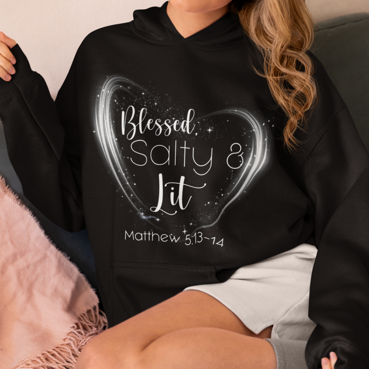 Person wearing a black hoodie with 'Blessed, Salty & Lit' text design.