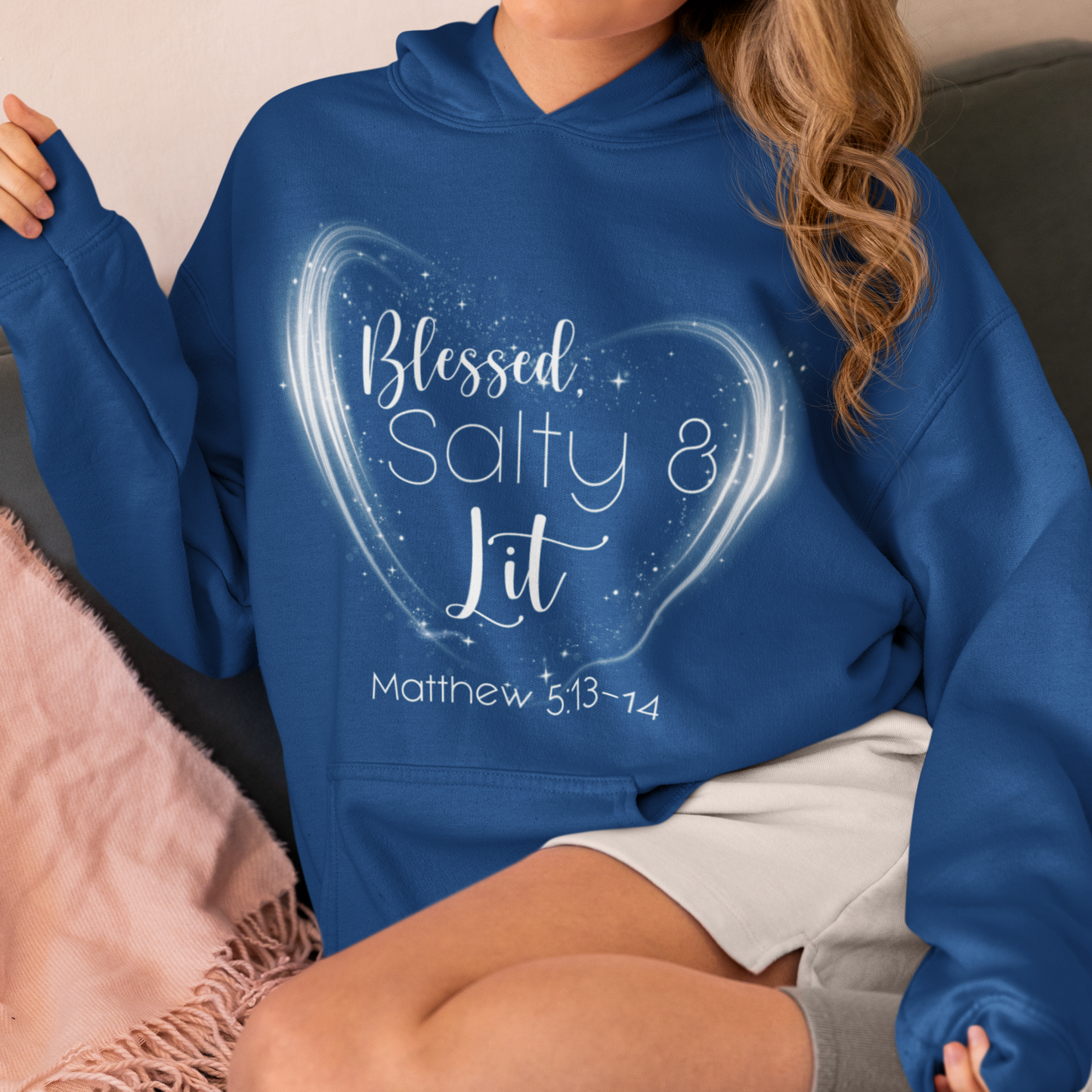 Person wearing a blue hoodie with 'Blessed, Salty & Lit' text design.
