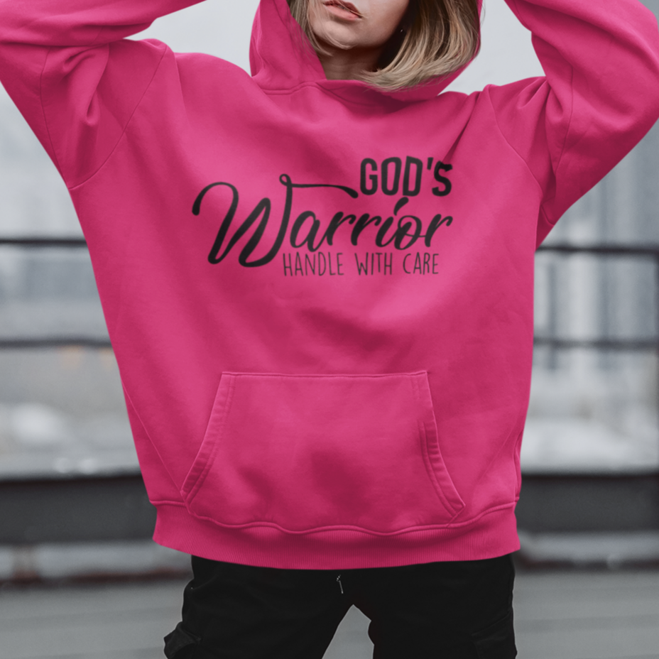 Person wearing a pink hoodie with text on a rooftop