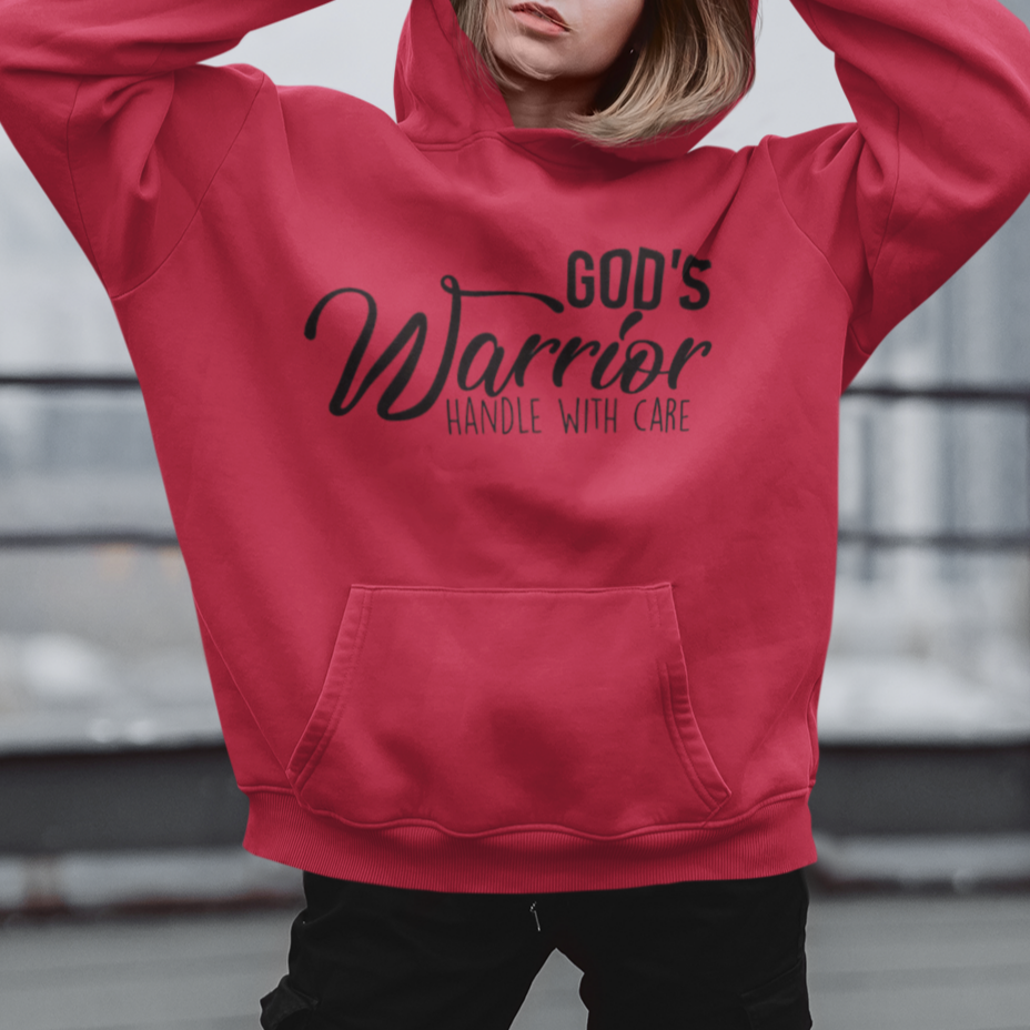 Person wearing a red hoodie with text, standing on a rooftop.