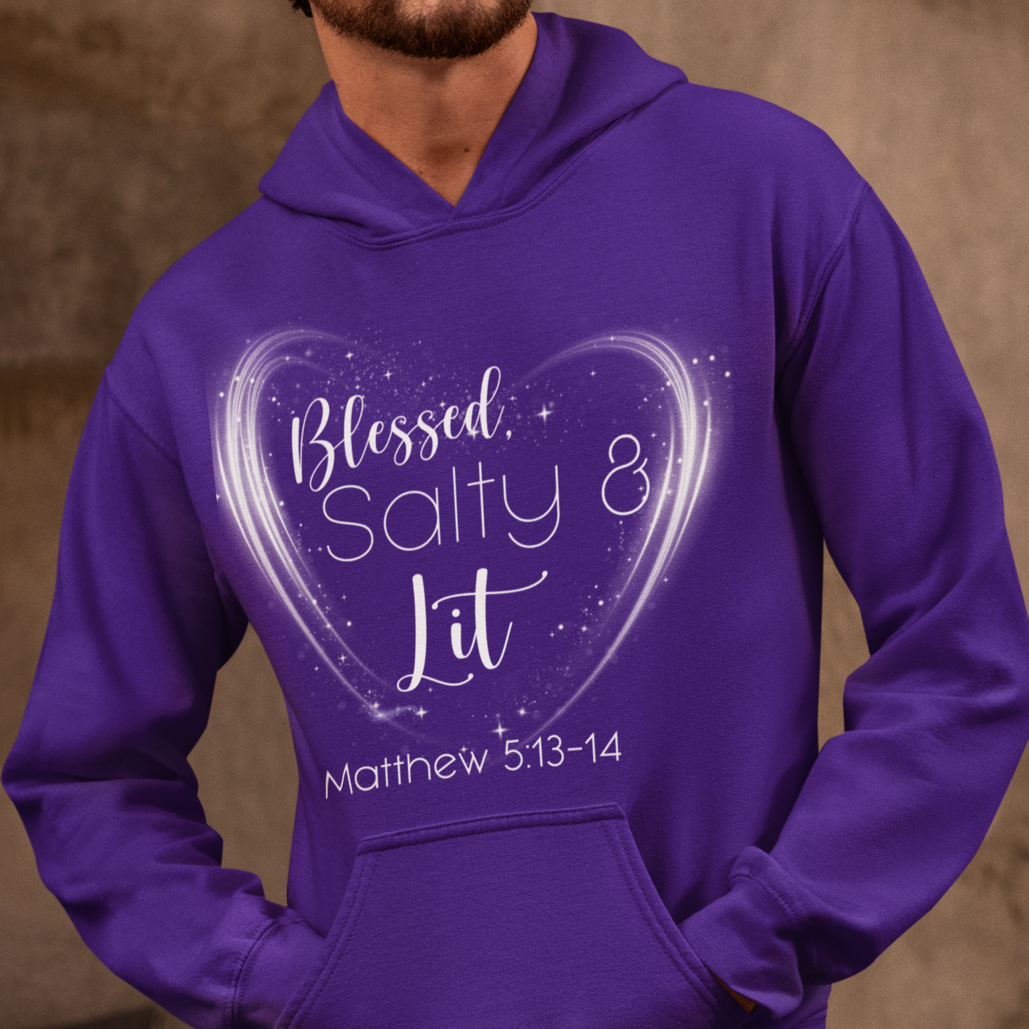 Person wearing a purple hoodie with a heart design and text.