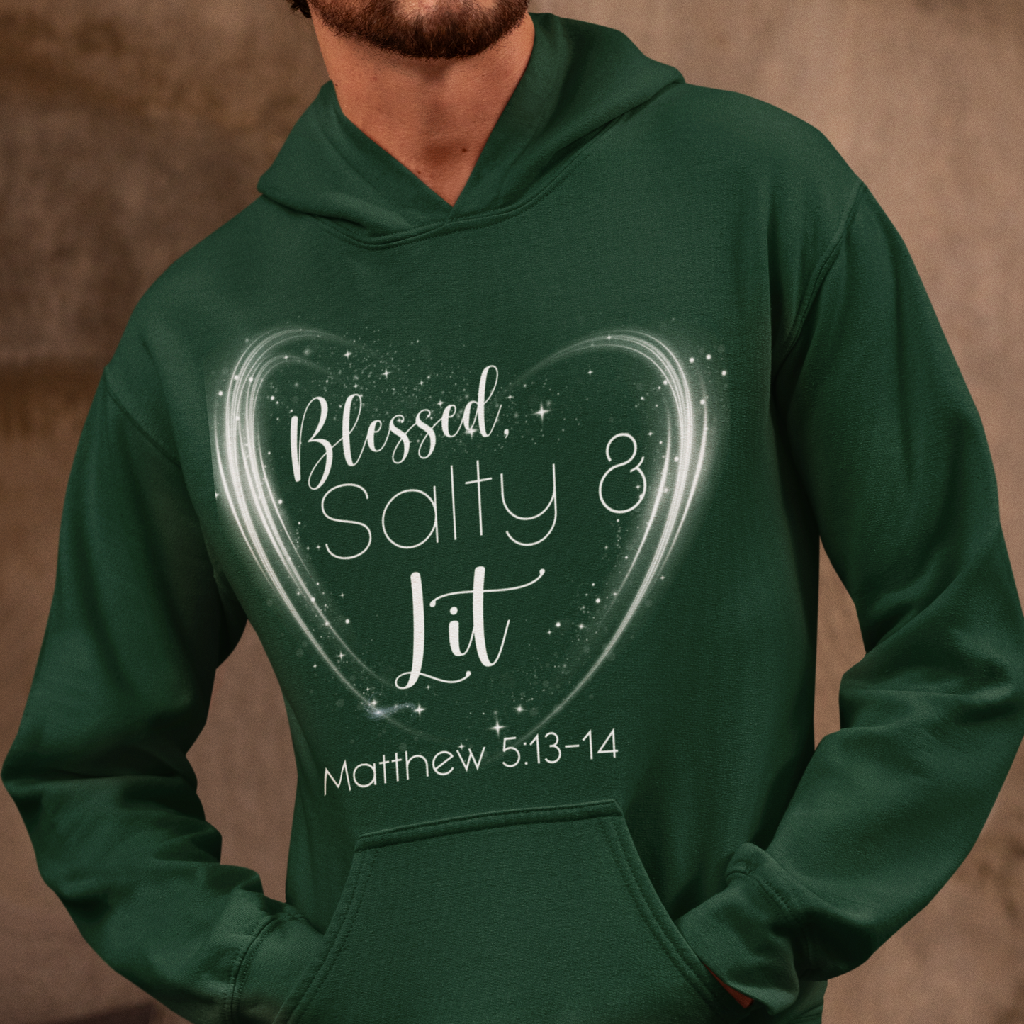 Person wearing a green hoodie with a heart design and text on a brown background
