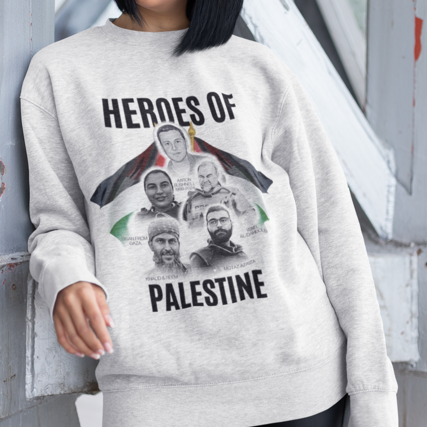 Person wearing a gray sweatshirt with 'Heroes of Palestine' graphic