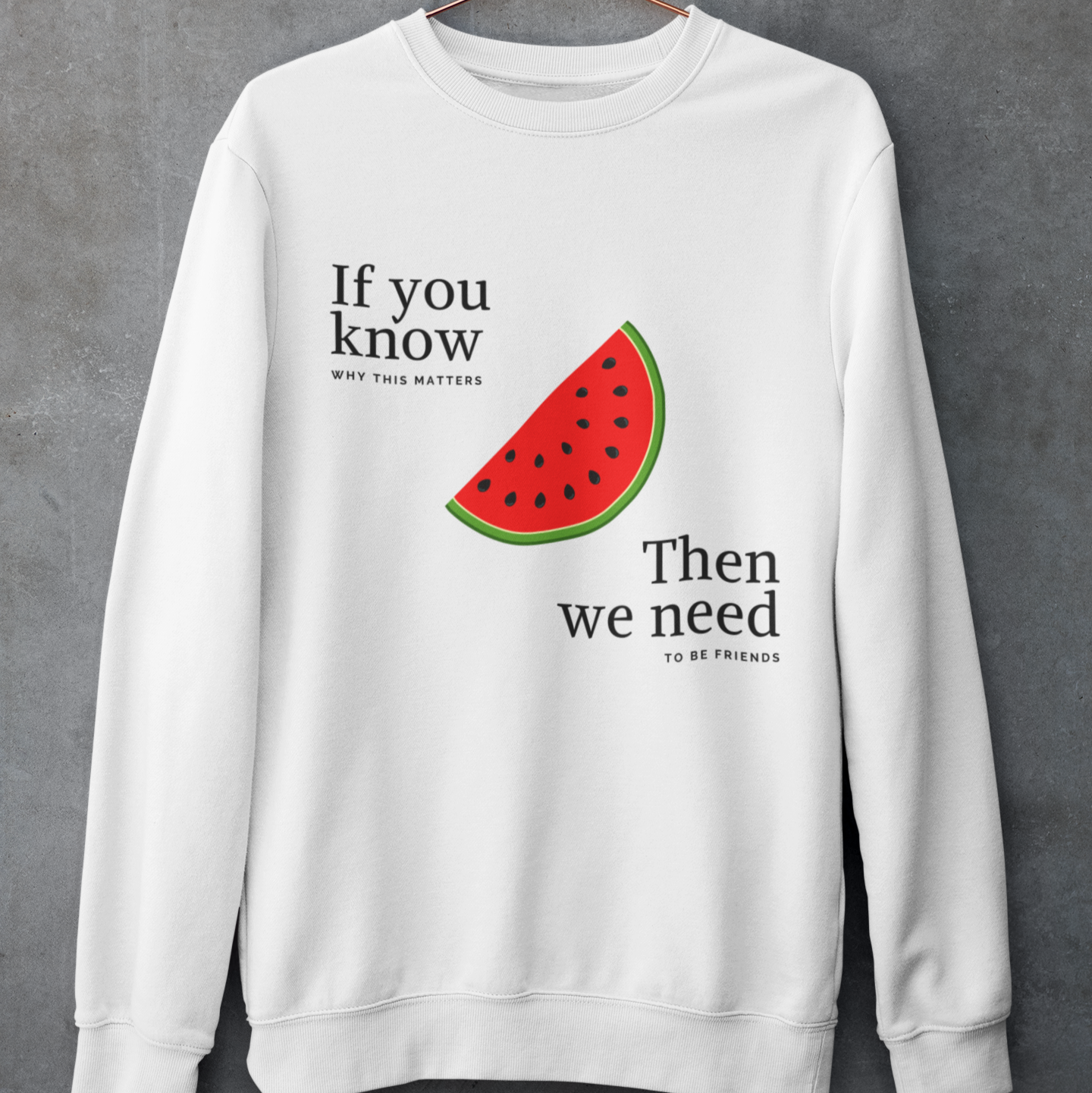 White sweatshirt with watermelon design and text on a gray background