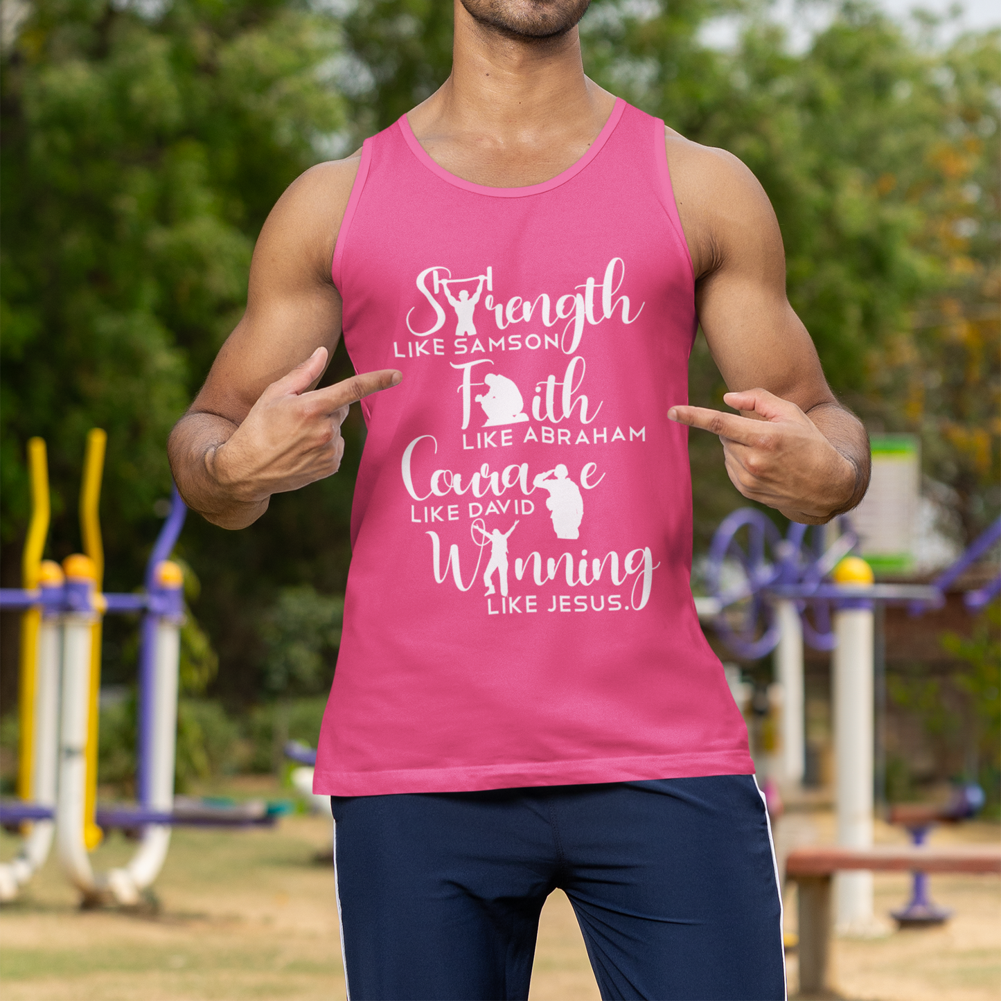 Man wearing a pink tank top with motivational text outdoors