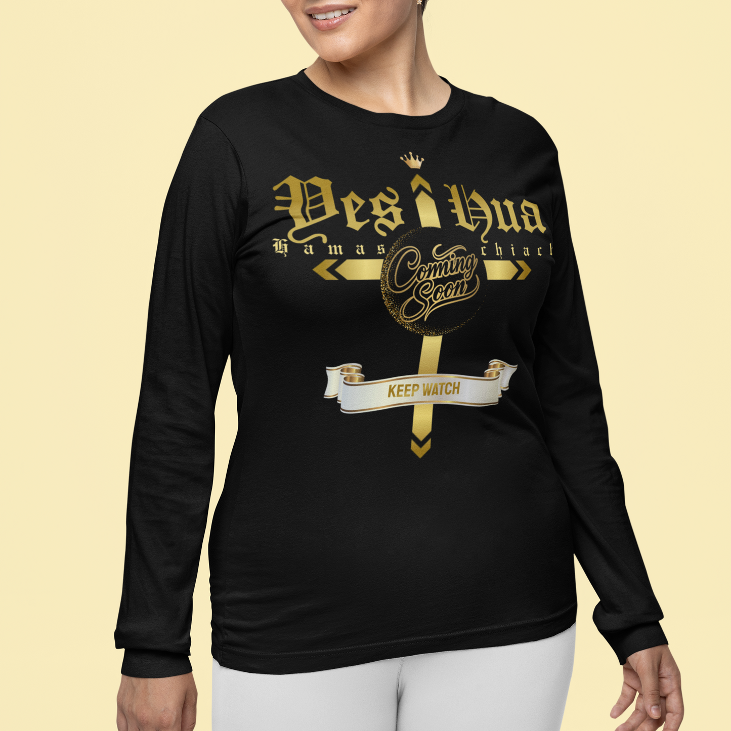 Woman wearing a black long-sleeve shirt with gold text on a beige background