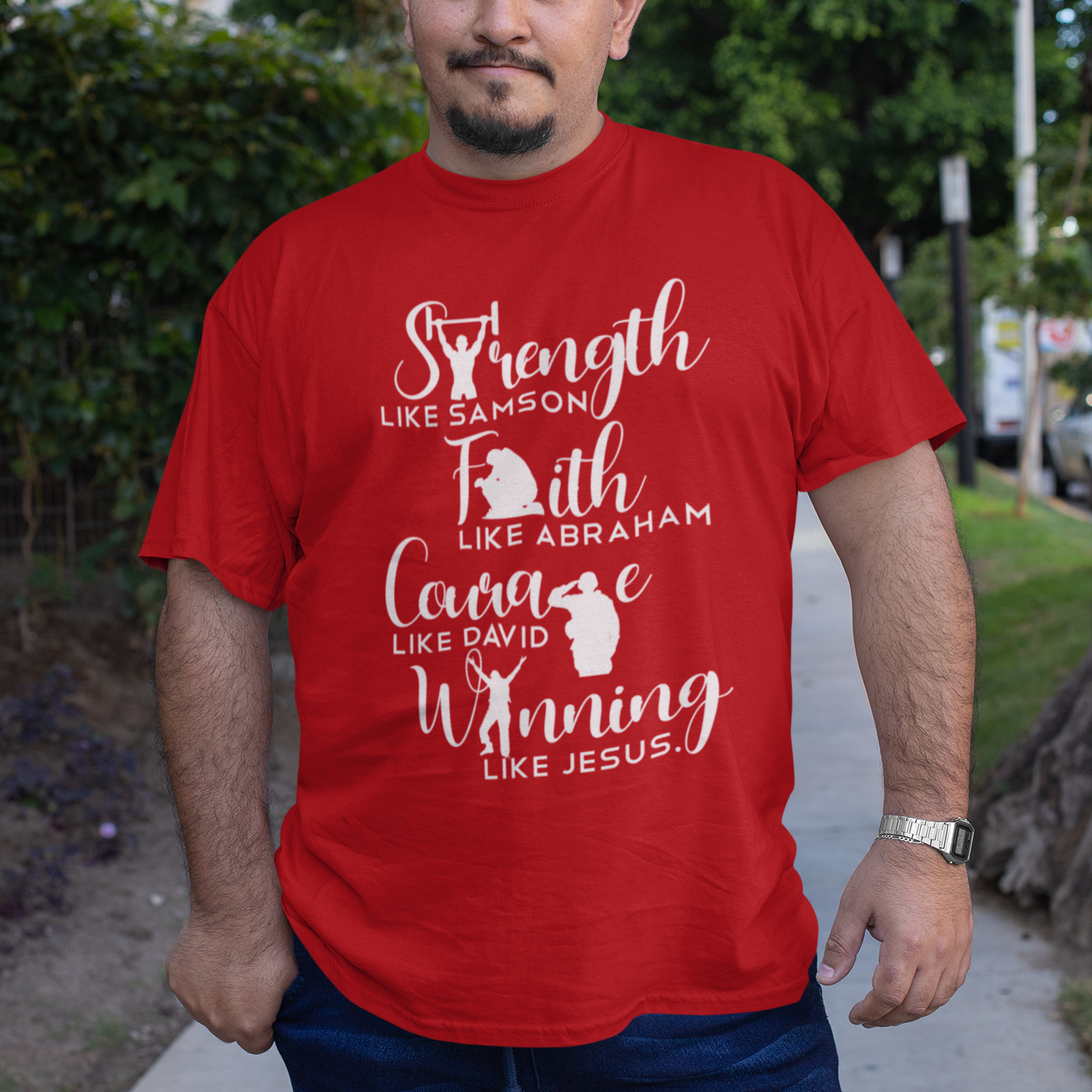 Man wearing a red t-shirt with motivational text and animal references, standing outdoors.
