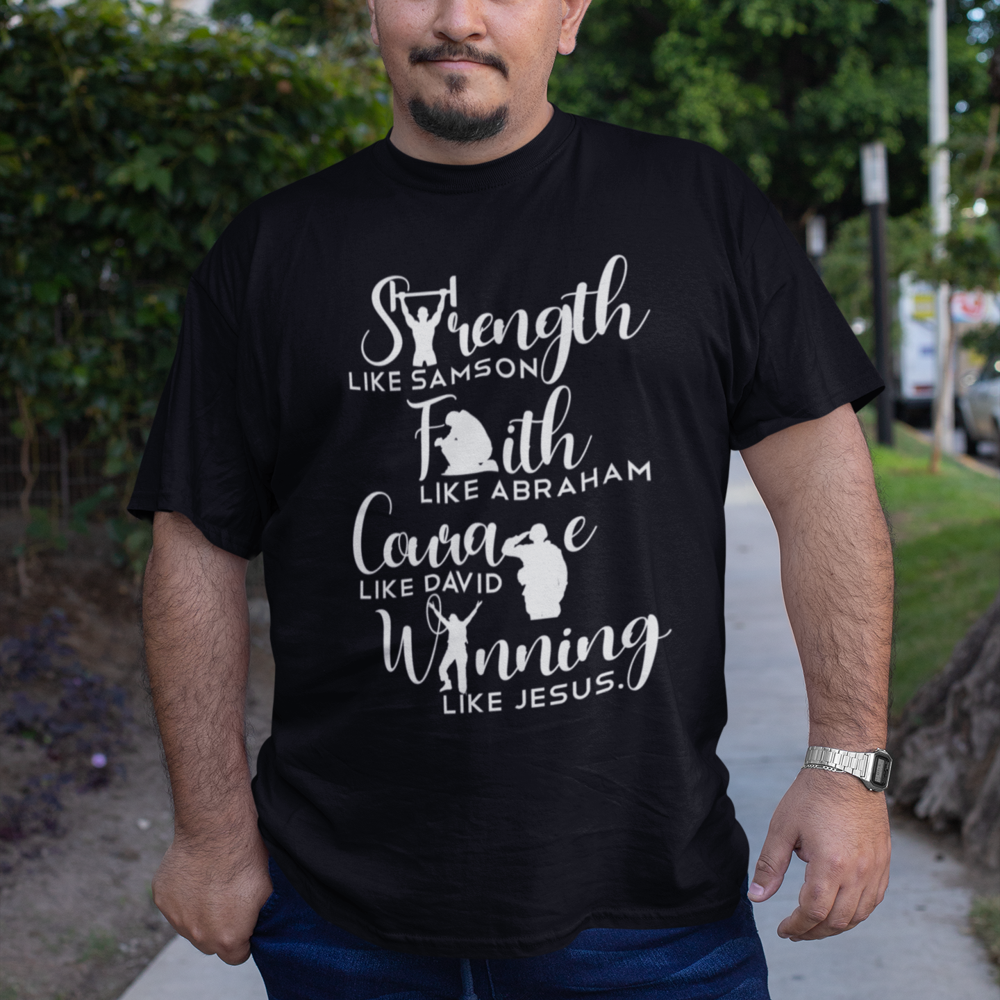 Man wearing a black t-shirt with motivational text outdoors