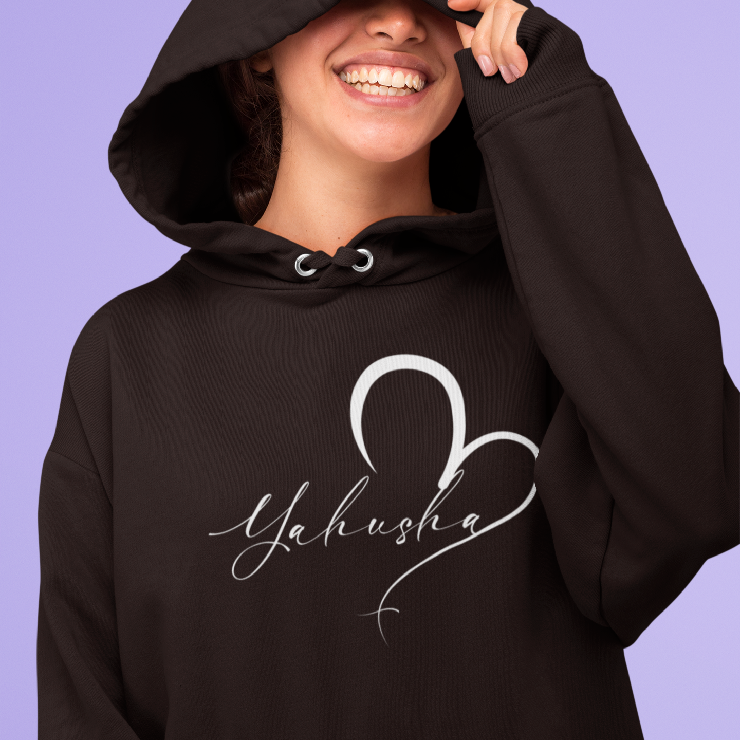 Person wearing a black hoodie with 'Yahuha' design on a purple background