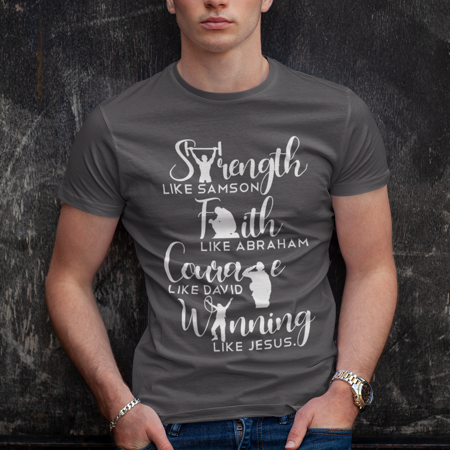 Man wearing a gray t-shirt with motivational text against a dark textured background