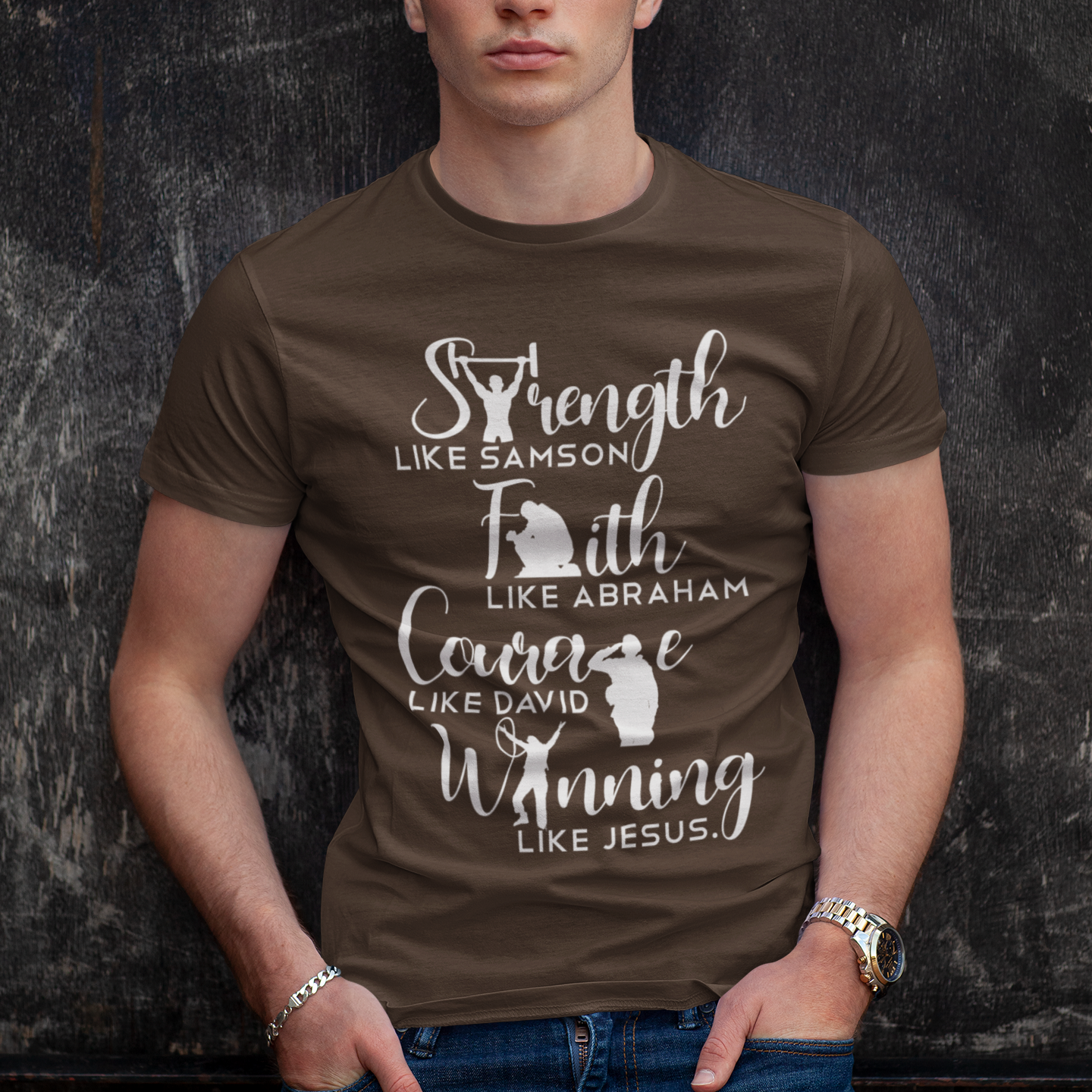 Man wearing a brown t-shirt with motivational text against a dark textured background