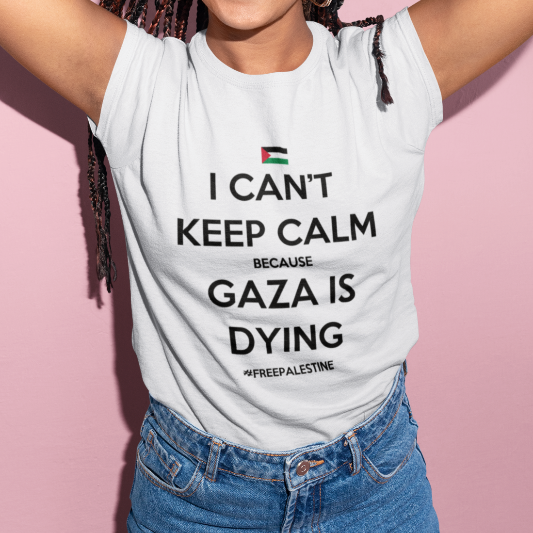 Person wearing a white t-shirt with a message about Gaza on a pink background