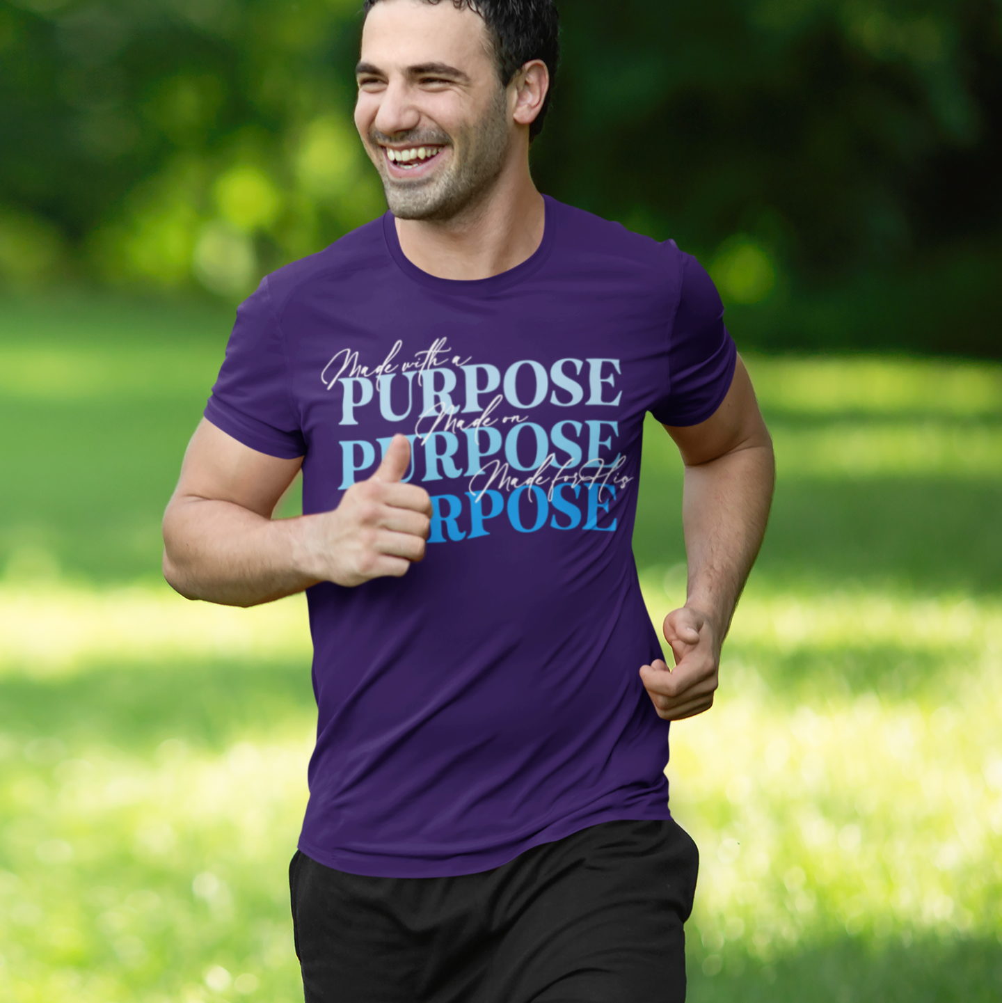 Man running outdoors wearing a purple t-shirt with 'PURPOSE' text