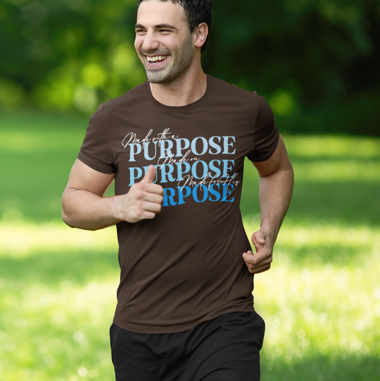 Man running outdoors wearing a brown t-shirt with motivational text