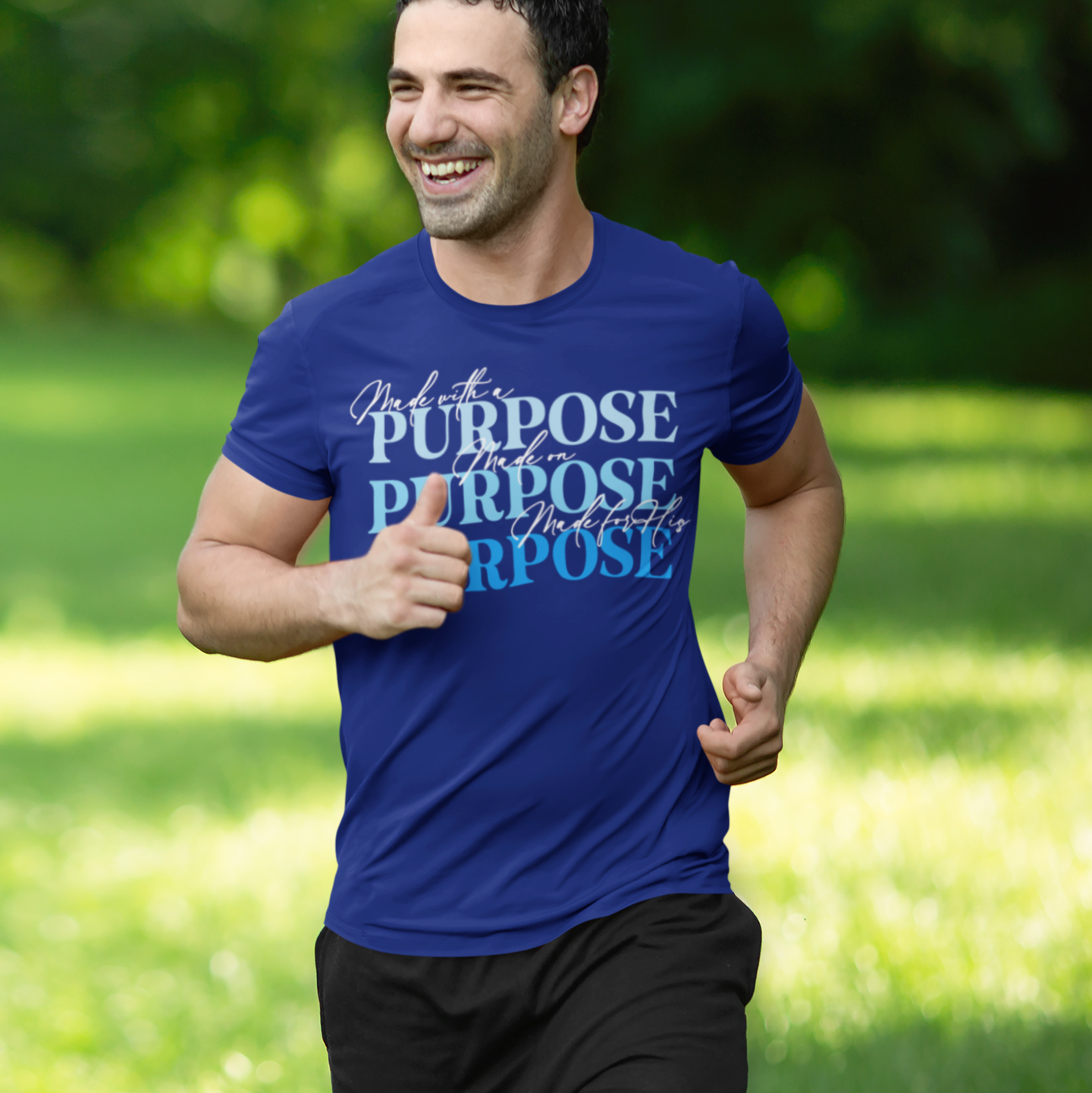 Man running outdoors wearing a blue t-shirt with 'Purpose' text