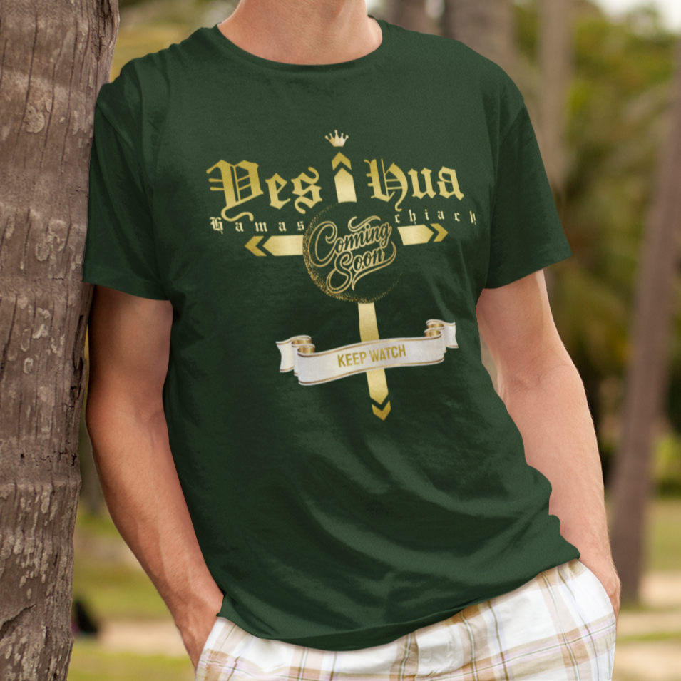 Person wearing a green t-shirt with text and graphics, standing against a palm tree.