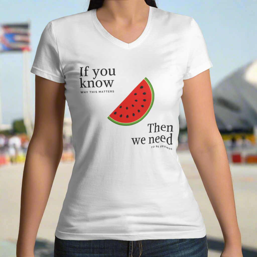 Person wearing a white t-shirt with a watermelon graphic and text on a light green background
