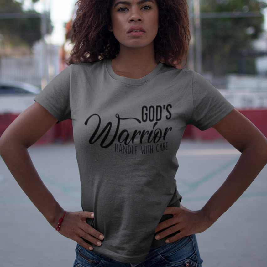 Woman wearing a gray t-shirt with 'GDP's Warrior' text on a court background
