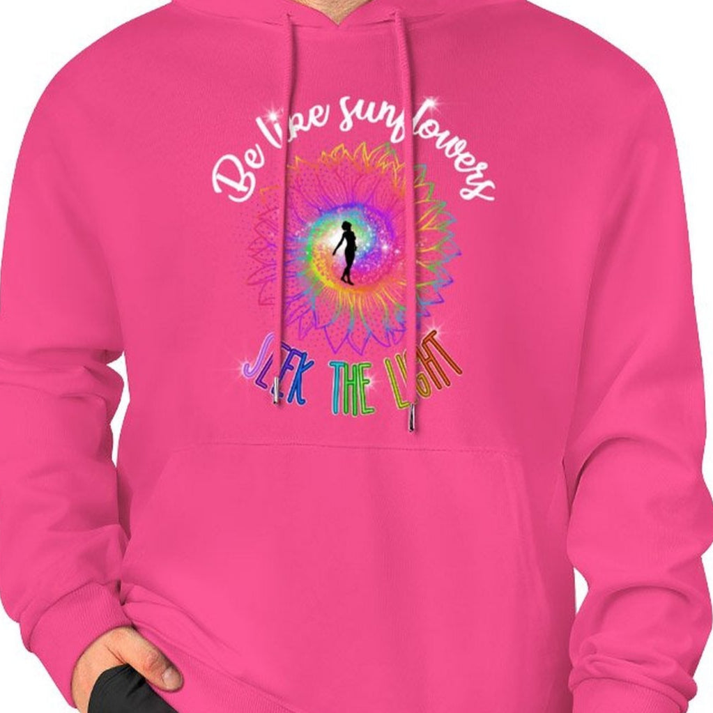 Person wearing a pink hoodie with a colorful design and text on a white background