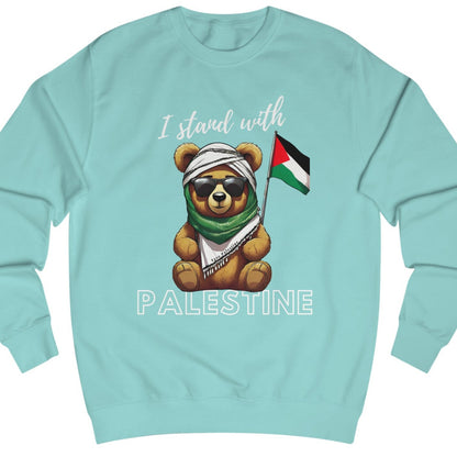 A blue unisex sweatshirt with an illustration of a teddy bear wearing a Keffiyeh and the text 'I STOOD WITH PALESTINE'.