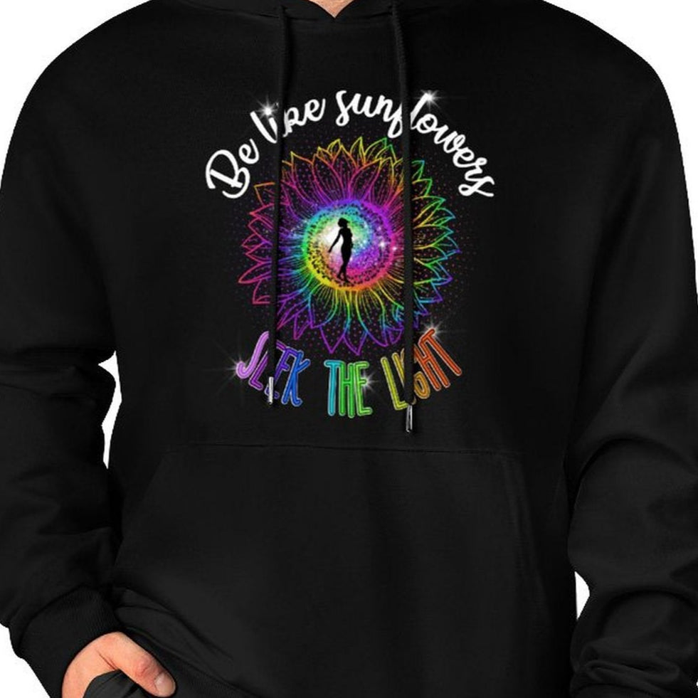 Black hoodie with colorful design and text worn by a person on a white background