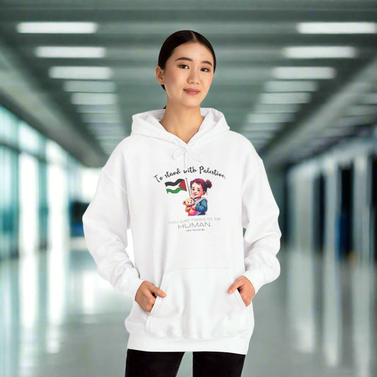 A person wearing a white unisex hooded sweatshirt with text and graphic design on the front.