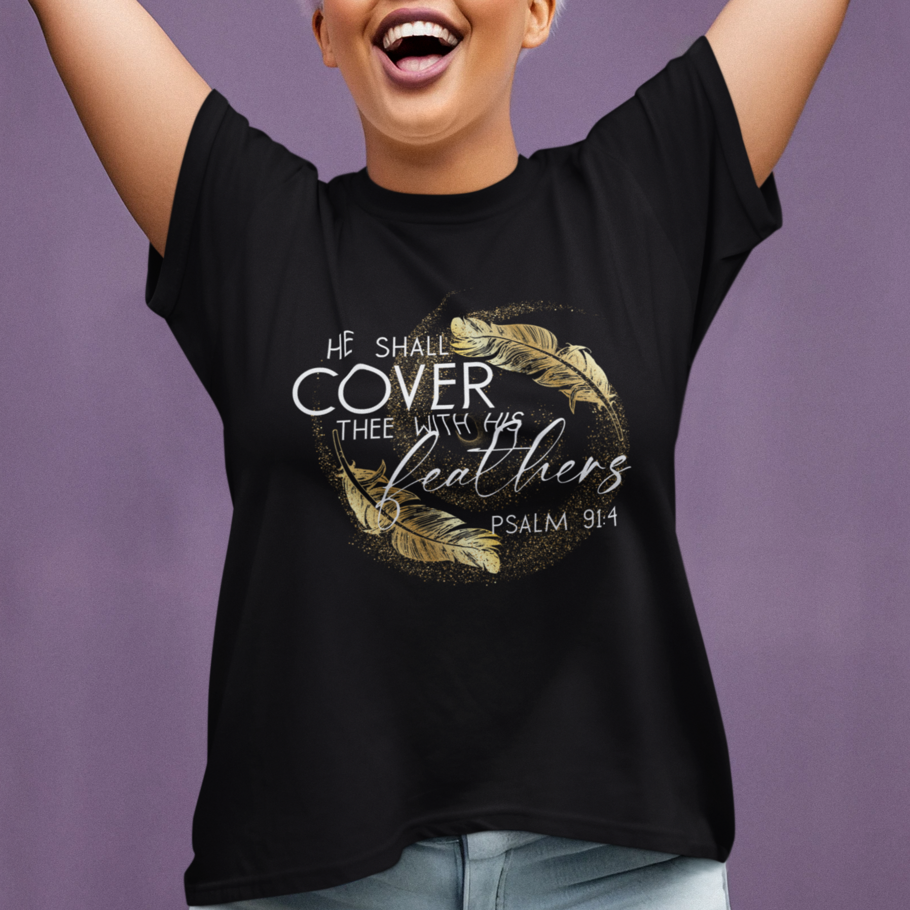 Woman wearing a black t-shirt with a design and text, raising her arms against a purple background