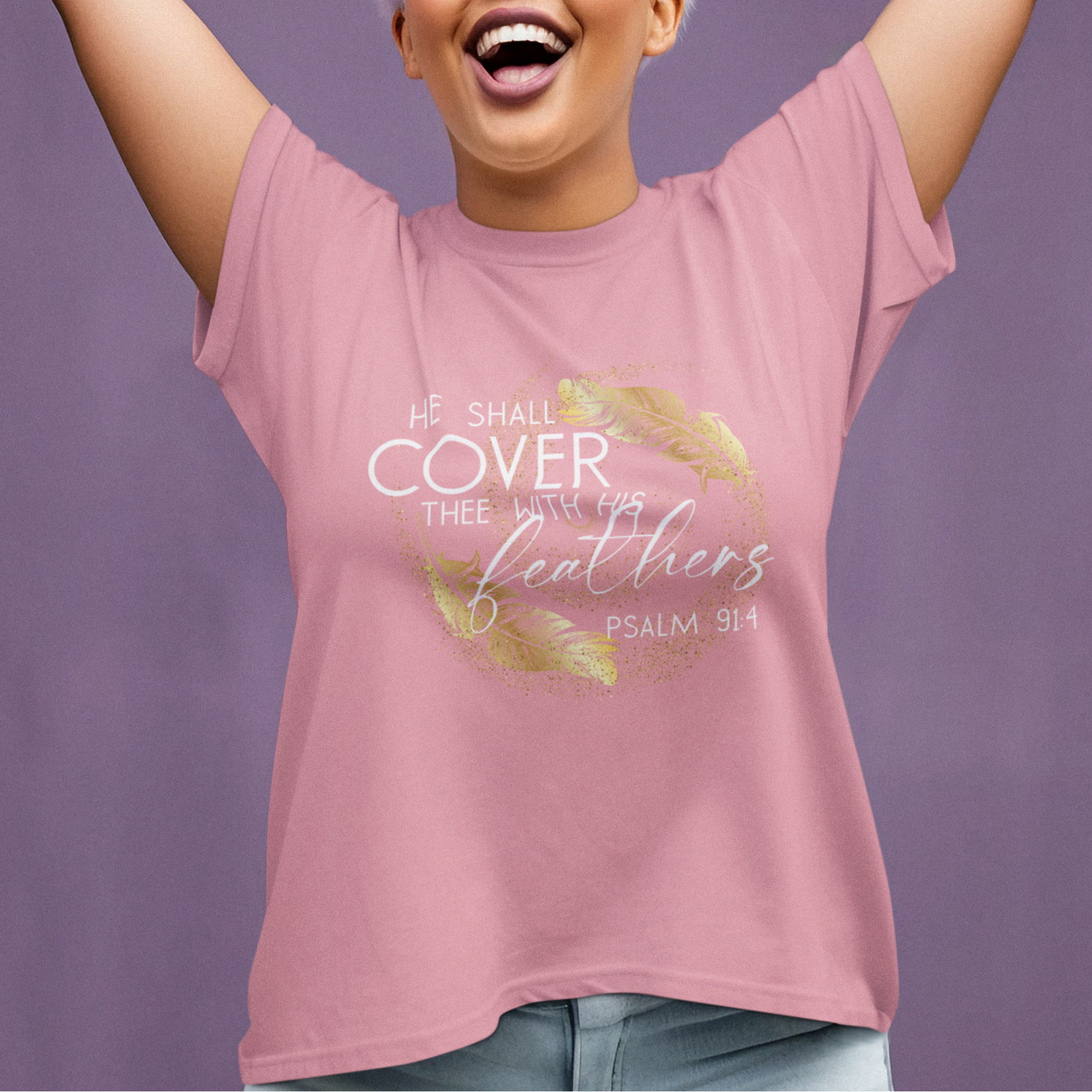 Woman wearing a pink t-shirt with a motivational quote against a purple background