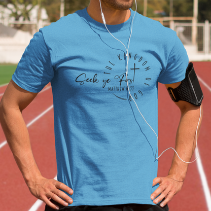 Man wearing a blue t-shirt with text on a running track