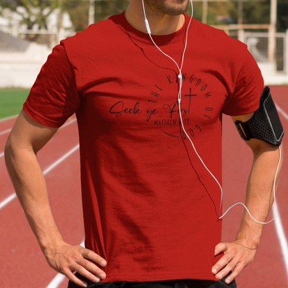 Man in red t-shirt with earphones on a running track