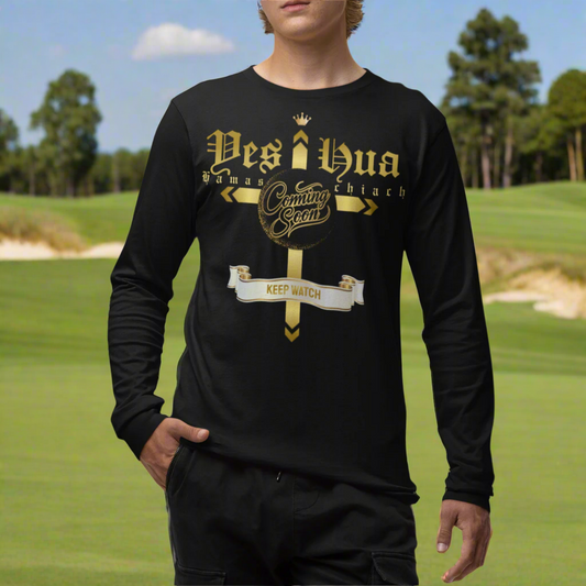 Person wearing a black long-sleeve shirt with gold text and graphics on a beige background