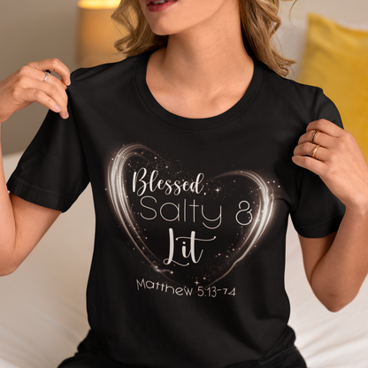 Person wearing a black t-shirt with a heart design and text.