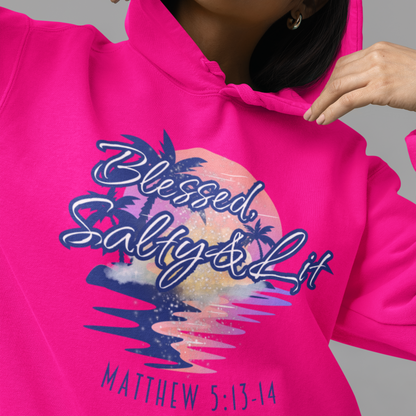 Person wearing a bright pink hoodie with a graphic design and text.
