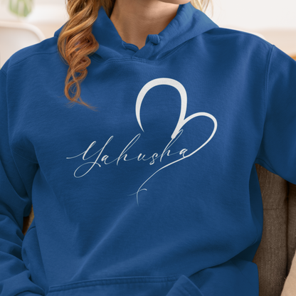 Person wearing a blue hoodie with 'Yahusha' design, sitting on a couch.