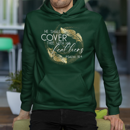 Man wearing a green hoodie with text and design, sitting on a chair indoors.