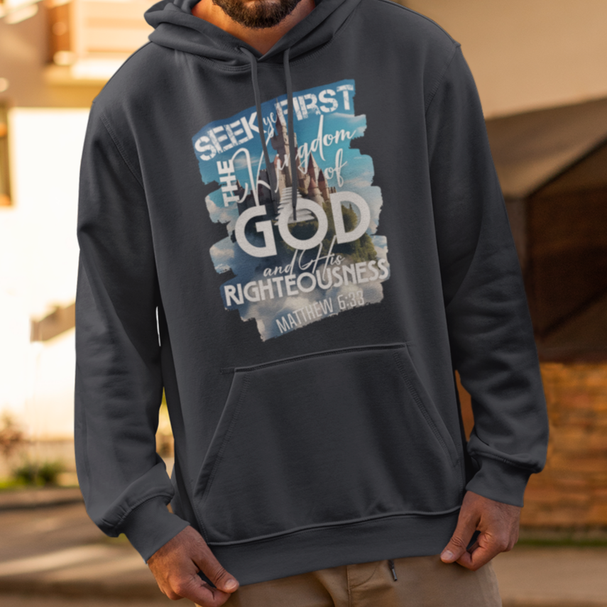 Man wearing a hoodie with text and graphics on a street