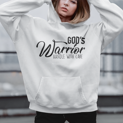 Person wearing a white hoodie with 'God's Warrior Handle with Care' text on a rooftop.