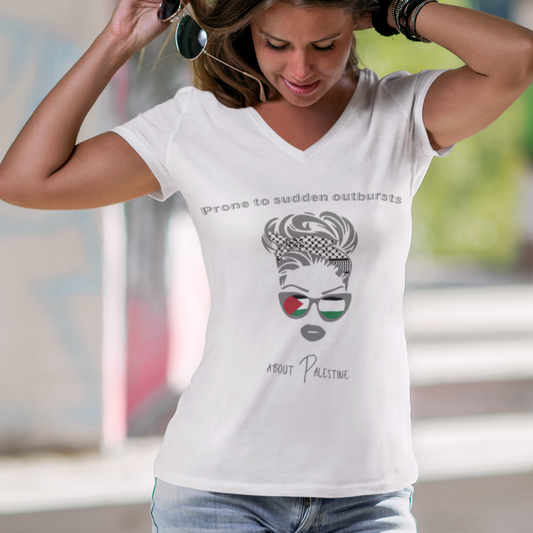 Woman wearing a white t-shirt with a graphic design in an urban setting