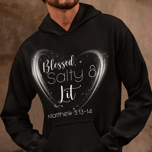 Person wearing a black hoodie with a heart design and text on a brown background