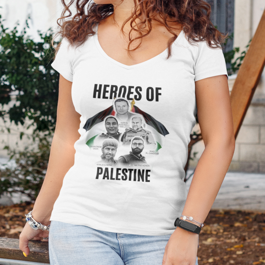 Woman wearing a white t-shirt with 'Heroes of Palestine' graphic outdoors.