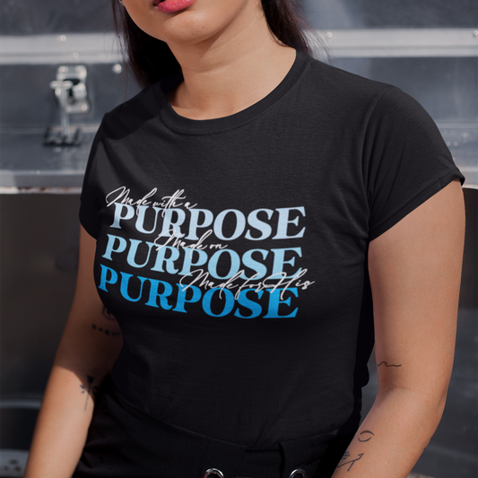 Woman wearing a black t-shirt with 'Purpose' text design.