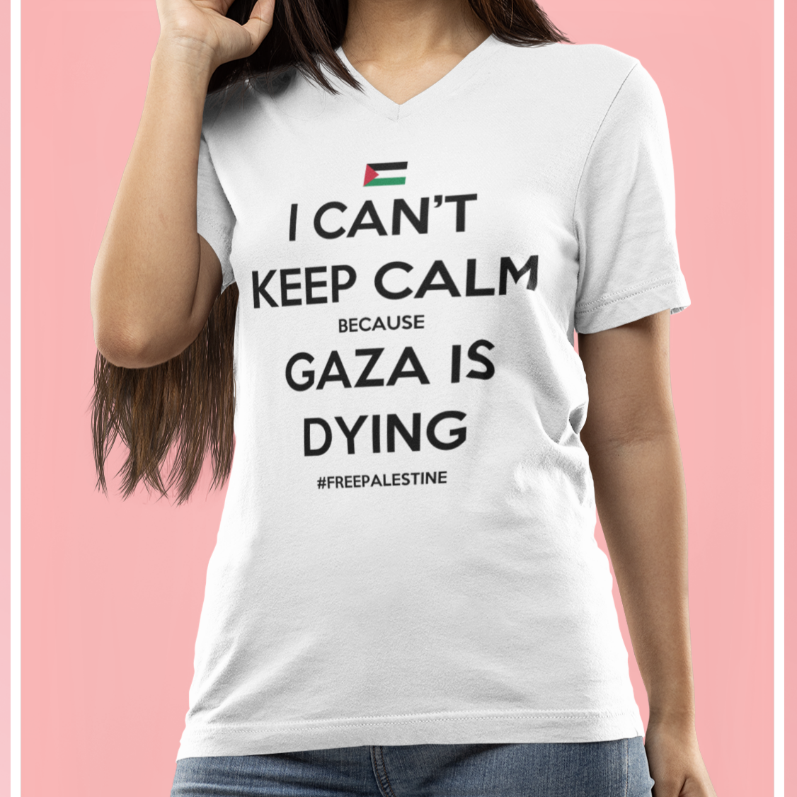 Person wearing a white t-shirt with a message on a pink background