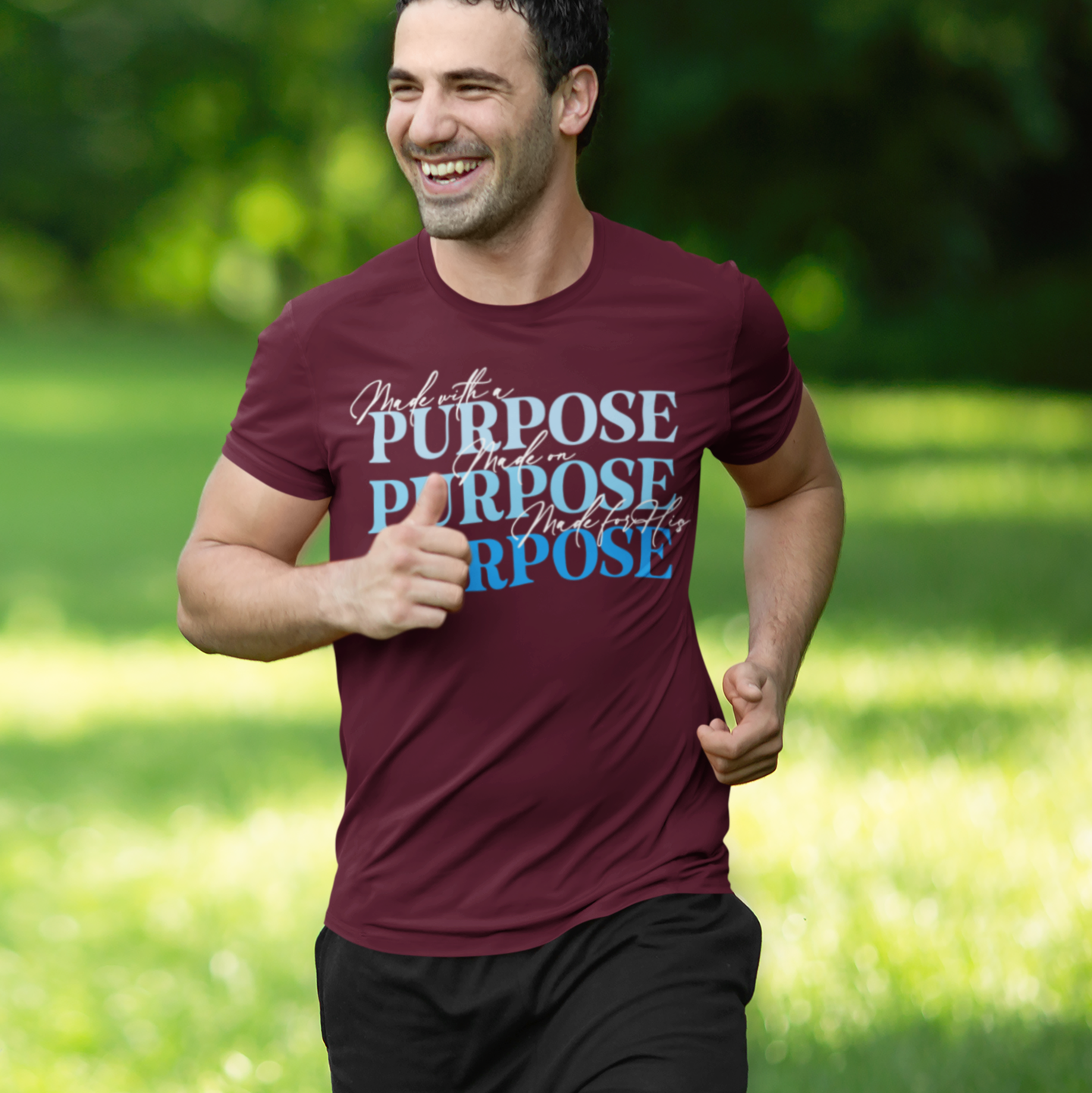 Man running outdoors wearing a maroon t-shirt with motivational text