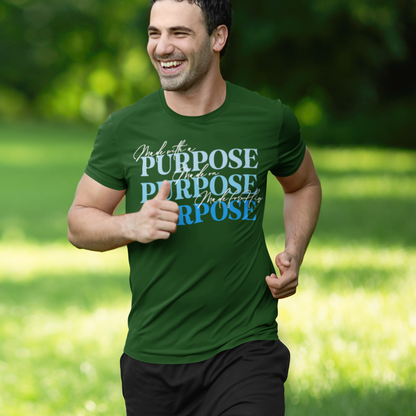 Man running outdoors wearing a green t-shirt with motivational text